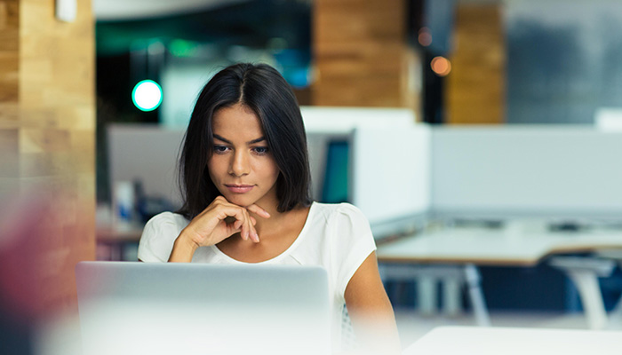 Person looking at their computer in an office