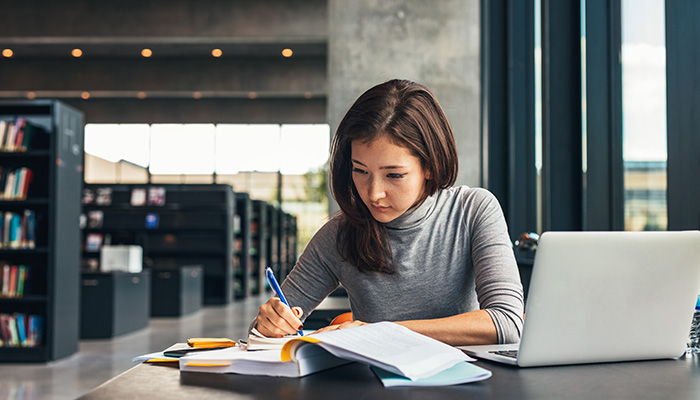 Student in a library studying